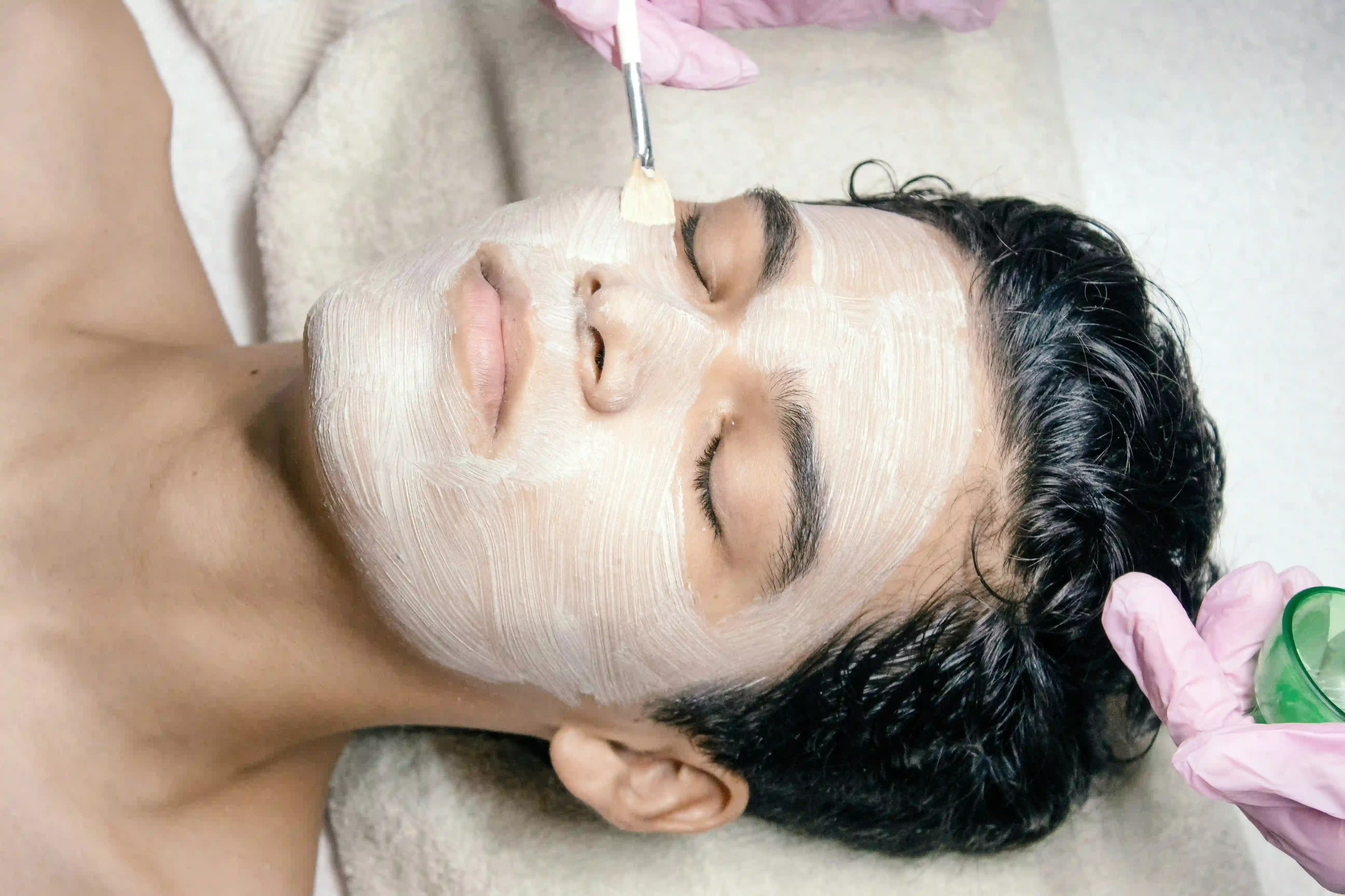 Professional esthetician tools and equipment compared with at-home skincare products