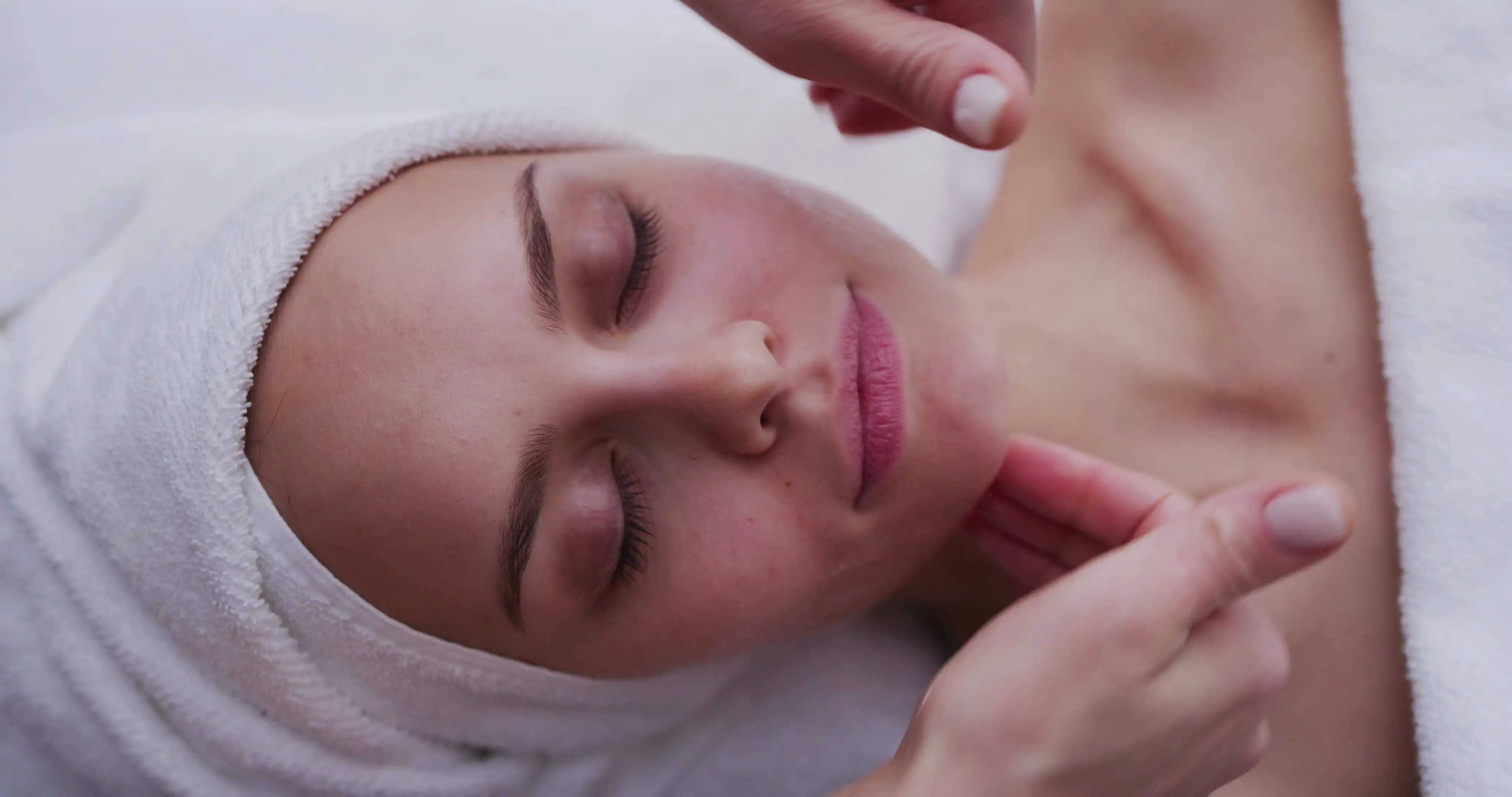 Client receiving professional facial treatment from licensed Oklahoma esthetician